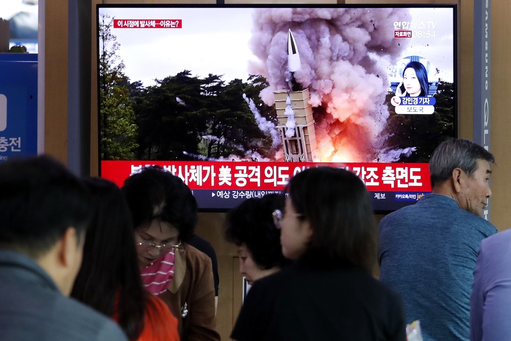 People in Seoul watch coverage of North Korea’s missile launch. Photo: AP