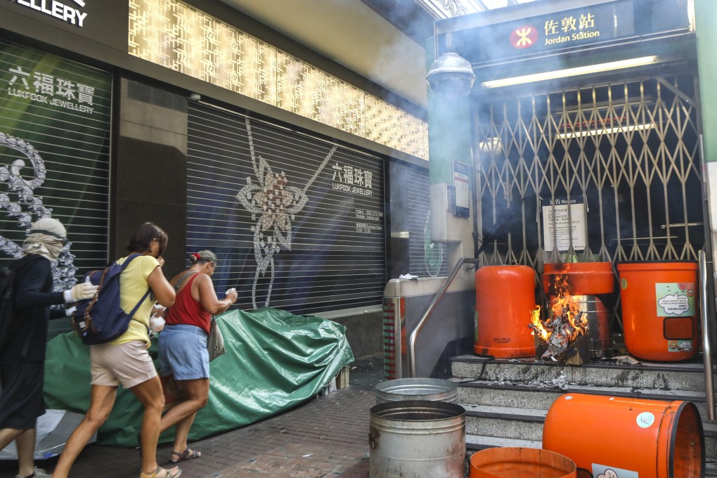 Protesters set fire to an entrance of Jordan MTR station on Tuesday. Photo: Dickson Lee