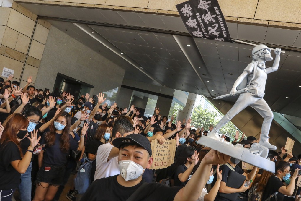 Supporters of those charged over Sunday’s clashes gather at West Kowloon Court on Wednesday. Photo: K.Y. Cheng
