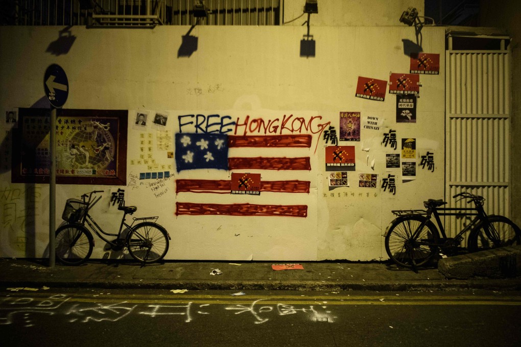Graffiti on a wall after violent demonstrations took place in the streets of Hong Kong on the 70th anniversary of the founding of the People’s Republic of China. Photo: AFP