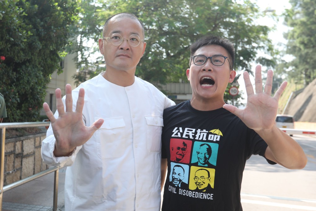 Lawmaker Shiu Ka-chun (left) and Raphael Wong, vice-chairman of the League of Social Democrats, celebrate their release from Stanley Prison. Photo: Nora Tam