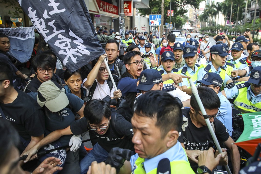 Police officers arrest suspects in the Hong Kong district of Wan Chai after scuffles on Tuesday. Photo: Winson Wong