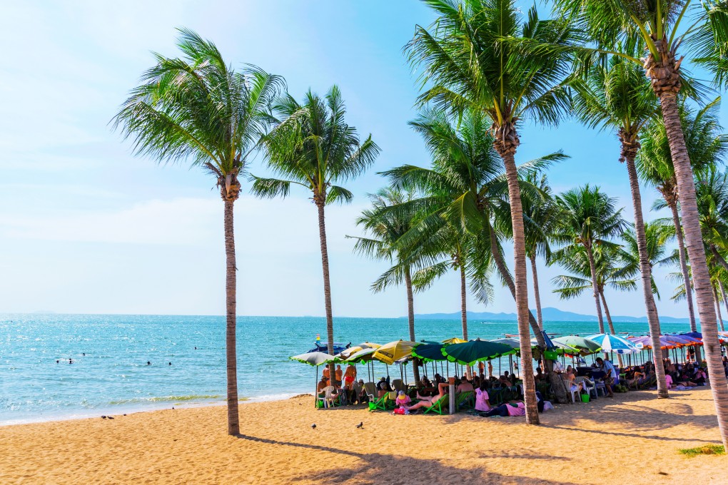 Tourists stick to the shade on Jomtien beach, near Pattaya. Picture: Handout