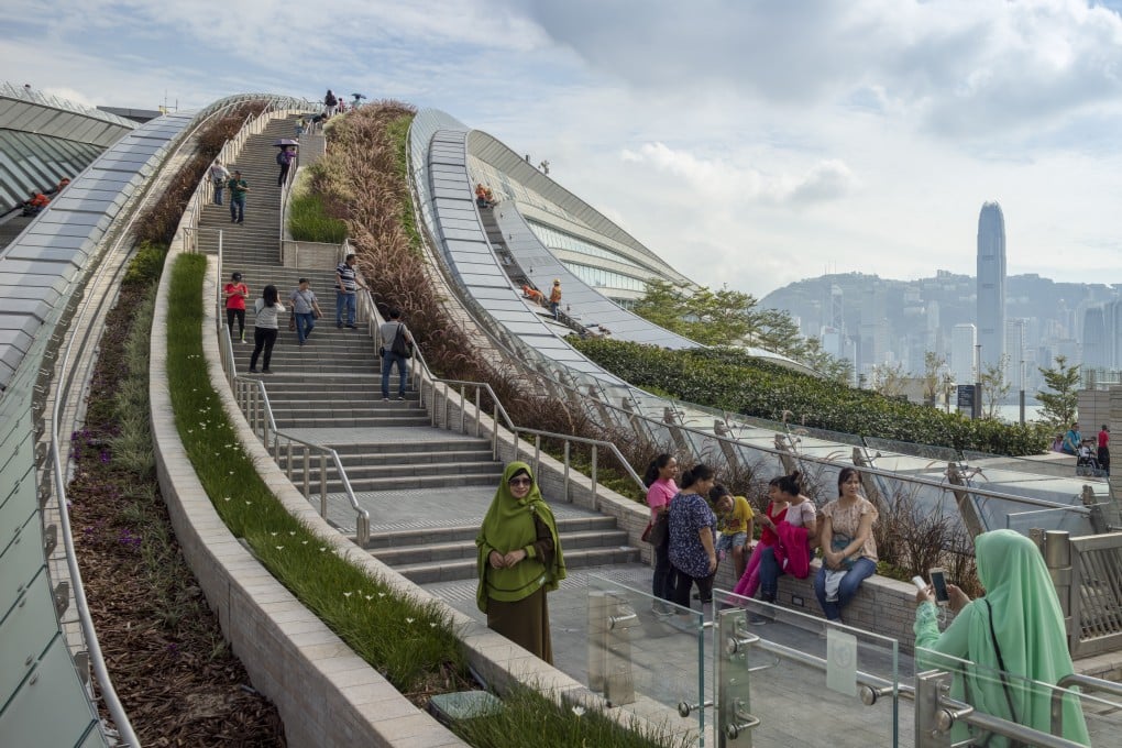 A sweeping staircase at the award-winning West Kowloon Station leads up to a plaza and is a place for social connection and greenery. Long curves and steps to the landscaped roof summon a spirit of nature. Photo: Paul Warchol
