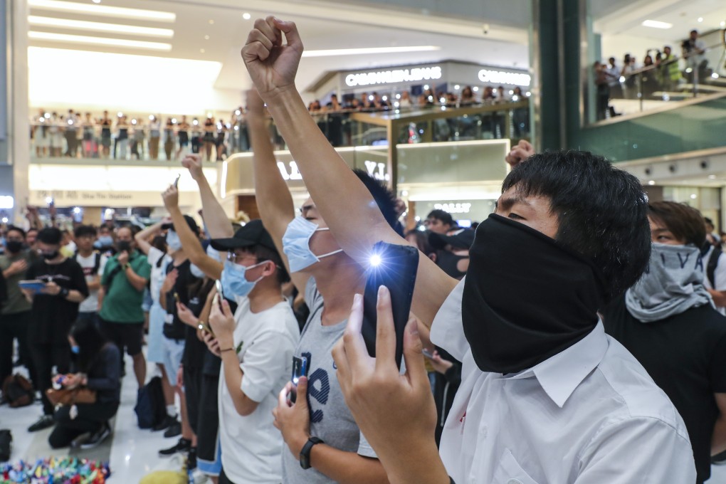 Protesters gather and sing at New Town Plaza mall in Sha Tin on October 2 in support of the 18-year-old protester shot by a police officer the day before. Photo: Sam Tsang