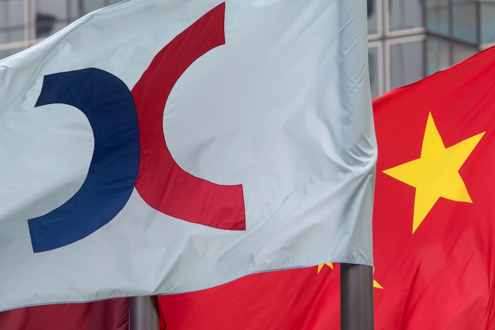 The corporate flag for Hong Kong Exchanges and Clearing and the Chinese flag fly outside the Exchange Square complex in Hong Kong. Photo: Bloomberg