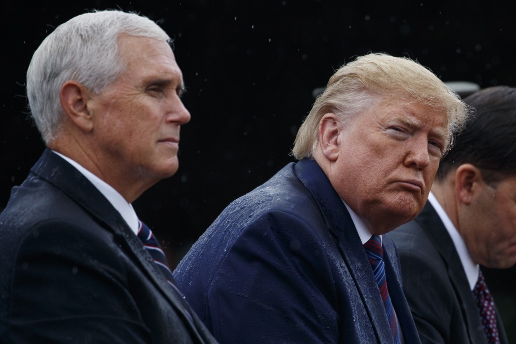 Vice-President Mike Pence and President Donald Trump take part in a welcome ceremony for the new chairman of the Joint Chiefs of Staff in Virginia on September 30. With the launch of a formal impeachment inquiry against Trump, US domestic politics has suddenly risen to the top of the list of concerns for financial markets. Photo: AP