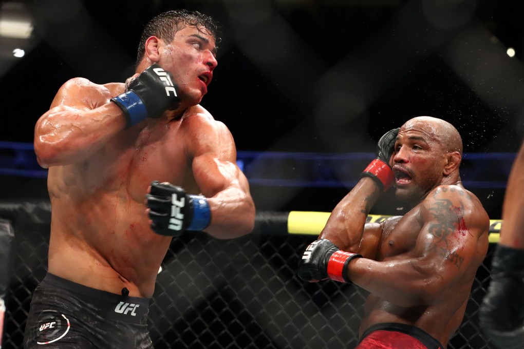 Paulo Costa throws a punch at Yoel Romero at UFC 241. Photo: AFP