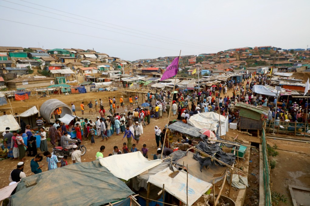 Rohingya refugees gather at a market inside a refugee camp in Cox's Bazar, Bangladesh, in March. Photo: Reuters