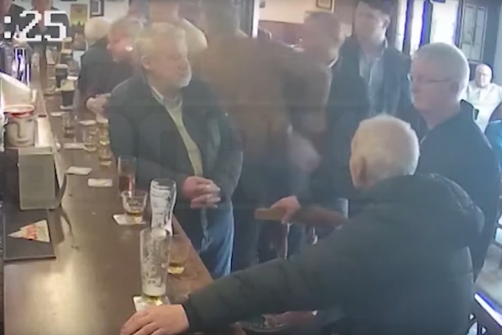Conor McGregor appears to aim a punch at an elderly patron of a bar in Dublin. Photo: YouTube/TMZ Sports