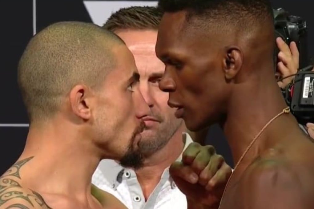 Robert Whitakker and Israel Adesanya face off at the weigh-in for UFC 243 in Melbourne. Photo: UFC Twitter