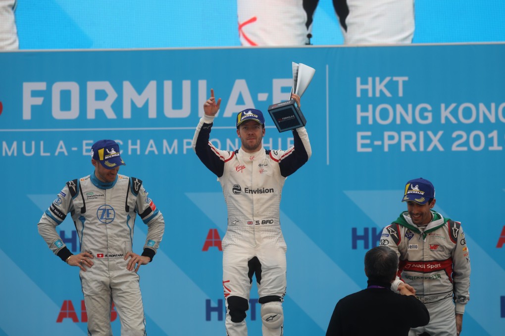 Sam Bird, of Envision Virgin Racing, celebrates on the podium at the Hong Kong E-Prix before he was given a five-second penalty and denied victory. Photo: SCMP / Sam Tsang