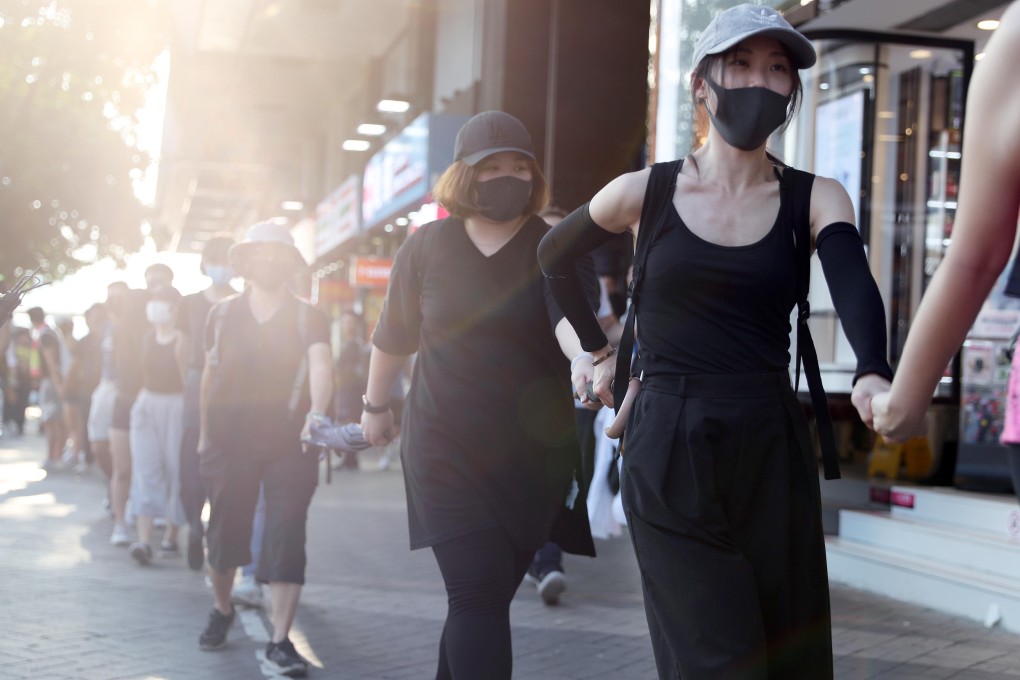 Protesters form a human chain outside the Star Ferry pier. Photo: Sam Tsang