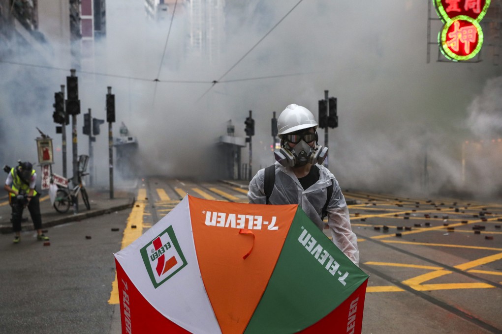 Clouds of tear gas have little effect on an anti-government protester in Wan Chai. Photo: Sam Tsang