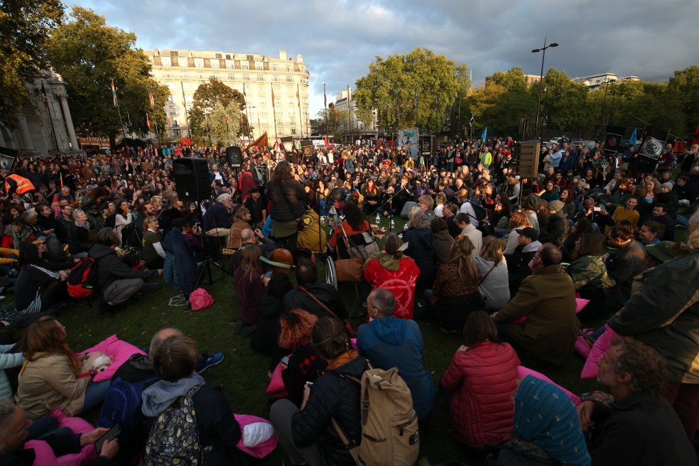 Extinction Rebellion protesters take part in a the opening ceremony of the International Rebellion campaign at Marble Arch. Photo: dpa