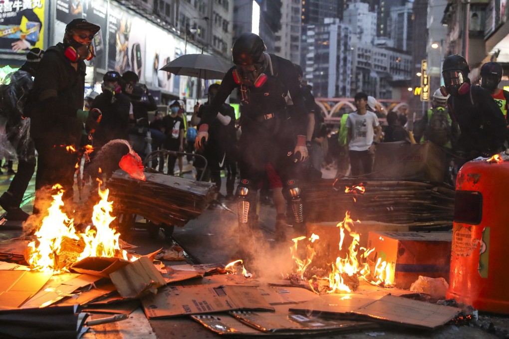 Anti-government protesters set fire to objects in Wan Chai following a rally in defiance of the anti-mask law on October 5. Photo: Sam Tsang