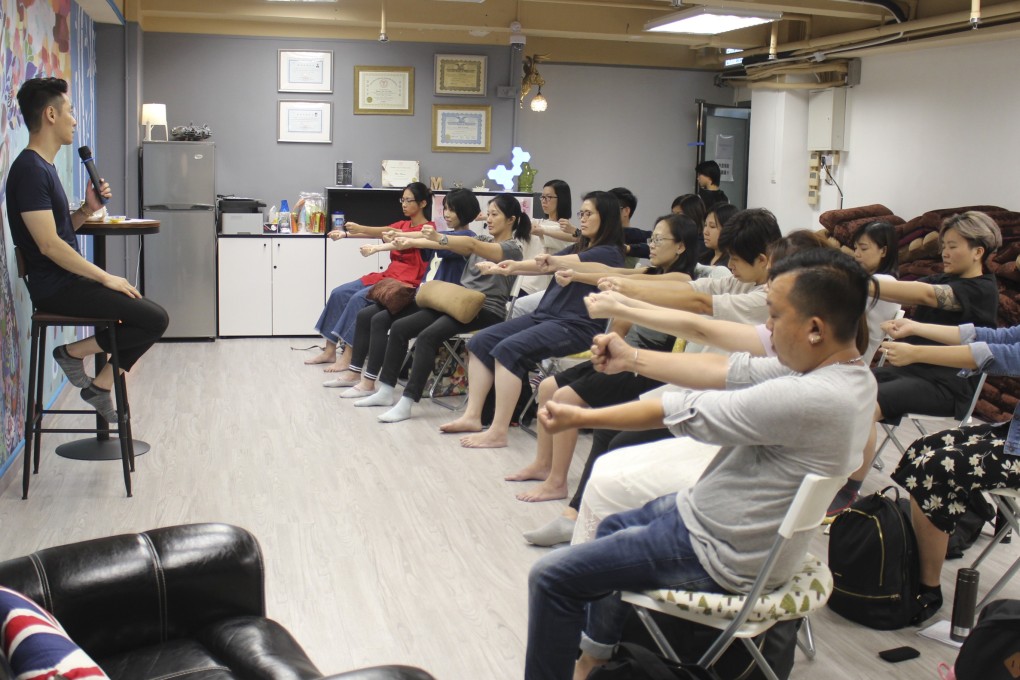 Max Shear leads a free trial hypnotherapy session at the Hypnosis Studio in Hong Kong. It gives people a chance to find about the benefits of hypnosis and to try it before signing up for therapy sessions. Photo: Snow Xia