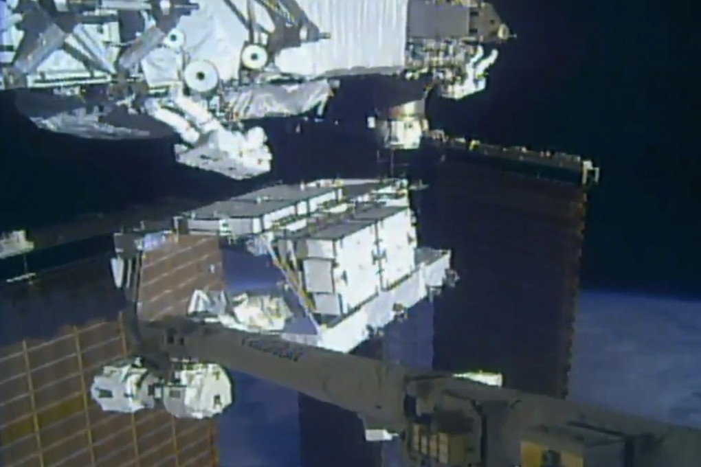 Nasa astronauts Christina Koch and Andrew Morgan work outside the International Space Station. Photo: Nasa via AP