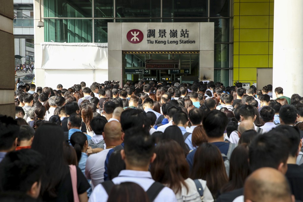 Commuters return to work on Tuesday to long queues at Tiu Keng Leng station, while 13 railway stations were closed and broken traffic lights caused gridlock on some roads. Photo: Winson Wong