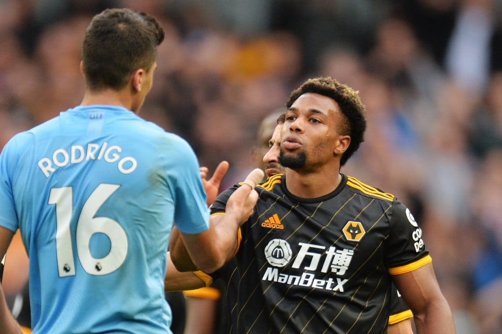 Wolverhampton Wanderers forward Adama Traore (right) shakes hands with Rodrigo, of Manchester City, after their English Premier League win at the Etihad Stadium. Photo: EPA