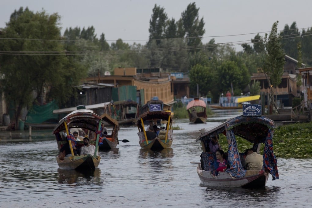 Tourists in shikaras, traditional gondolas, cross the Dal Lake in Indian-controlled Kashmir. Photo: AP