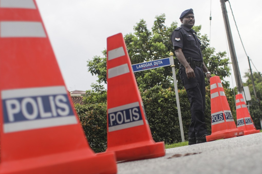 A Malaysian police officer stands guard in Kuala Lumpur. Photo: EPA