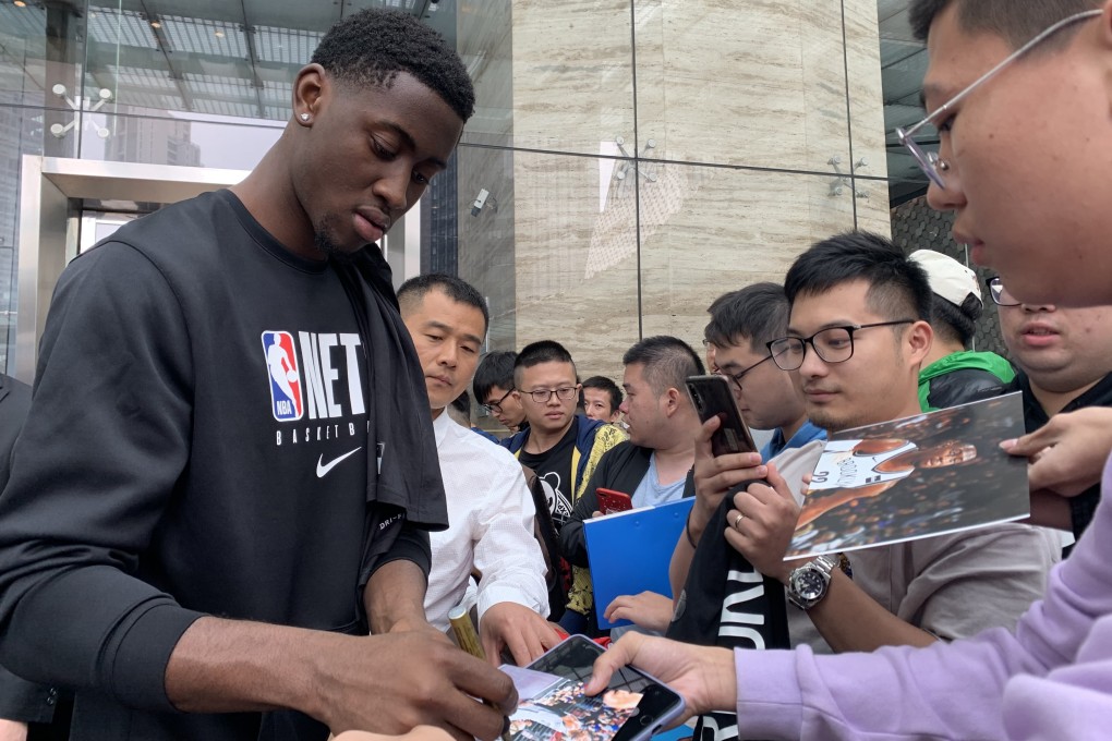 The Brooklyn Nets’ Caris LeVert signs autographs for fans outside the Shanghri-La hotel in Shanghai. Photo: Thomas Yau