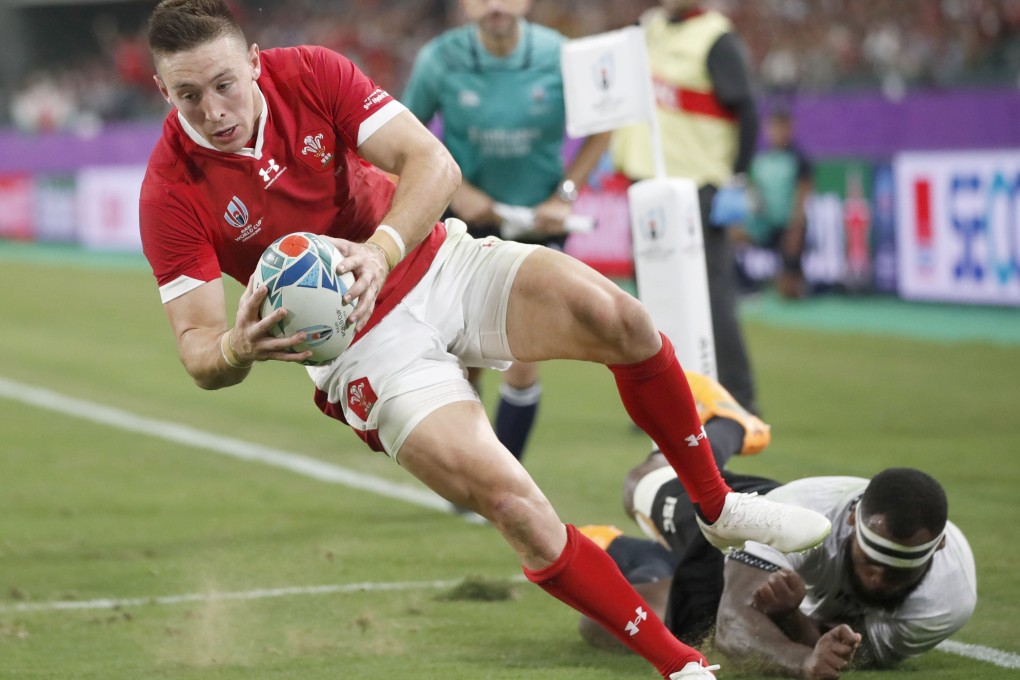 Wales’ Josh Adams scores his second try during the first half of the Rugby World Cup pool D match against Fiji in Oita. Photo: Kyodo