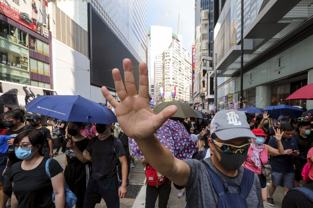 Protesters march from the Sogo department store in Causeway Bay to Charter Garden in Central. Photo: Felix Wong