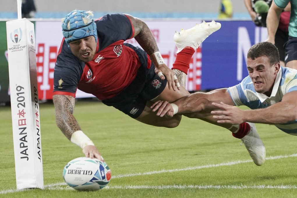 Jack Nowell scores for England against Argentina. Little did they know, this would be their last pool game. Photo: EPA