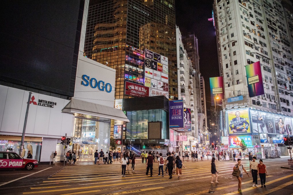 Pedestrians cross an unusually quiet intersection in Causeway Bay in Hong Kong on October 7. Photo: Bloomberg