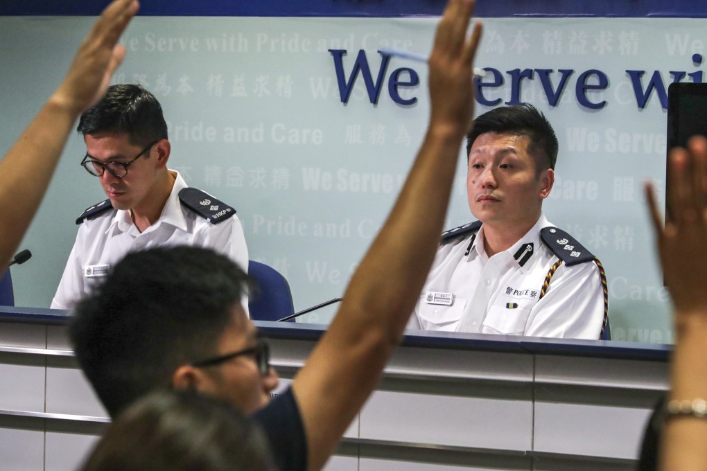 Kong Wing-cheung and Tse Chun-chung, of the Police Public Relations Branch hold a press conference at the Hong Kong Police Headquarters, in Wan Chai, in August. Photo: Edmond So