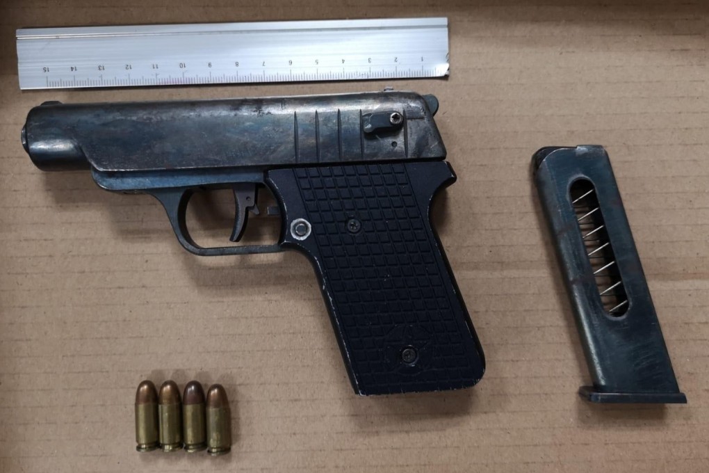 The pistol and four rounds of live ammunition were found along with other weapons in a car parked in Deep Bay Road on Wednesday afternoon. Photo: Handout