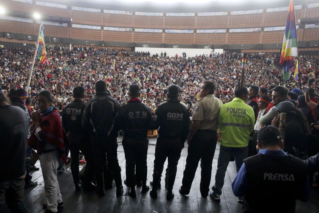 Police detained by anti-government protesters are presented on a stage at the Casa de Cultura in Quito, Ecuador. Photo: AP