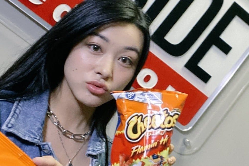 Emily Mei poses with a bag of Flamin’ Hot Cheetos in a photo posted on Twitter on Thursday. Photo: Emily Mei via Twitter