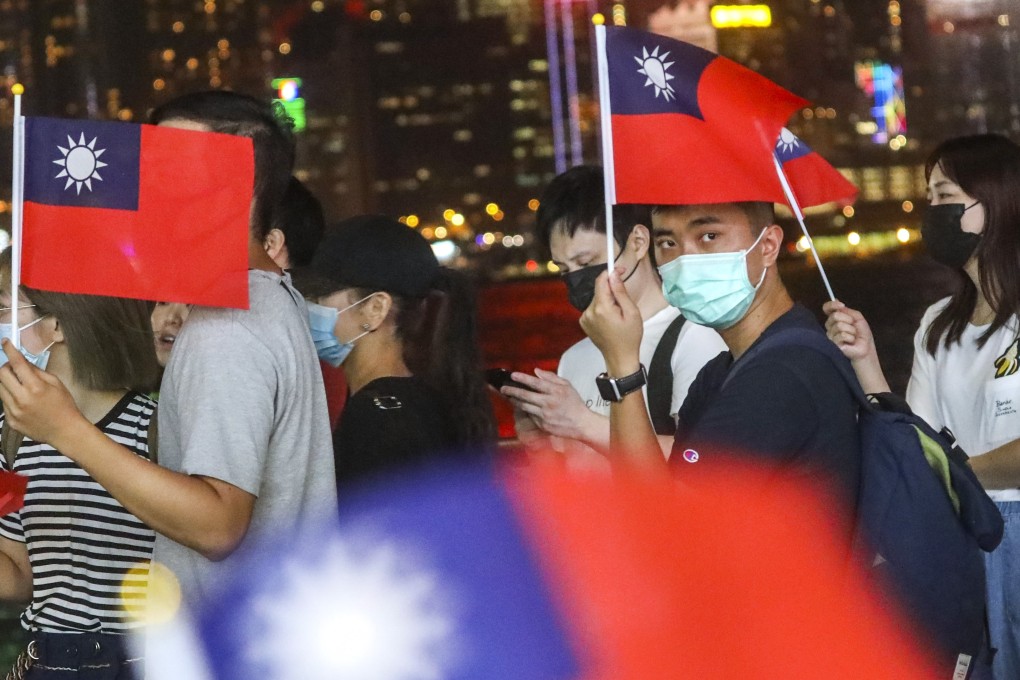 Protesters wave Republic of China flags in Tsim Sha Tsui to celebrate Taiwan’s “Double Tenth” holiday. Photo: Dickson Lee