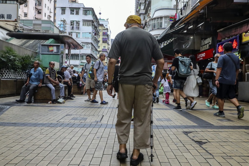 An elderly man walks down a street in Sham Shui Po in June. Older adults are prone to bone fractures as a result of osteoporosis. Photo: Edmond So