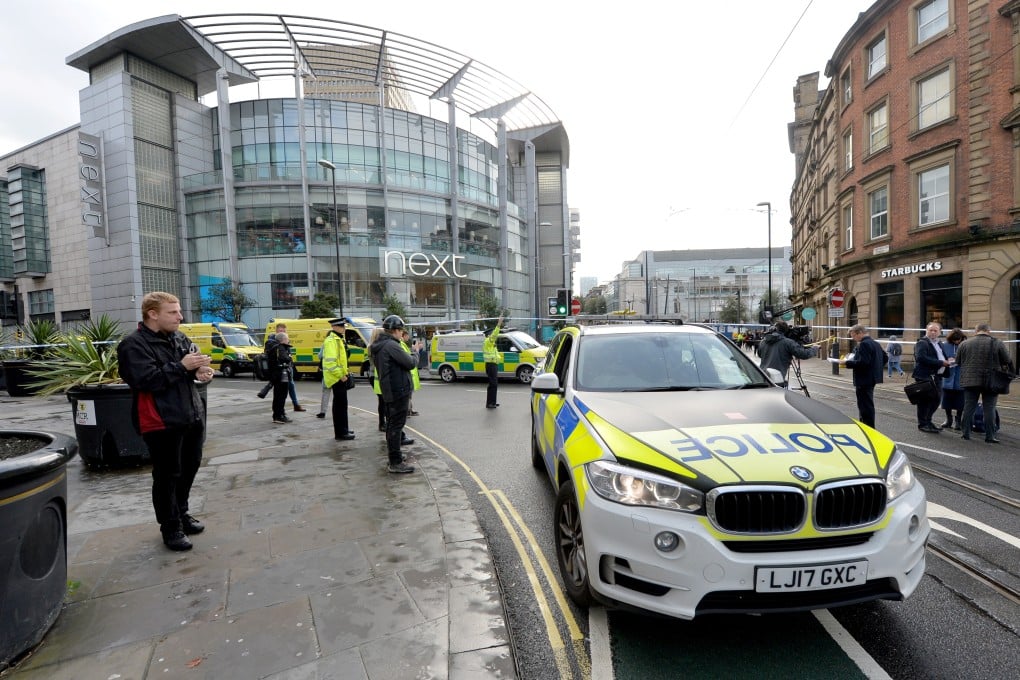 Police cars are seen outside the Arndale centre in Manchester. Photo: Reuters