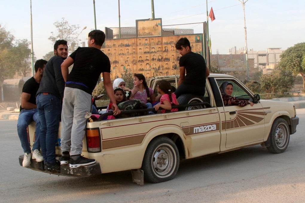 Kurdish families flee their hometowns Ras al-Ein due to the Turkish offensive in northern Syria. Photo: EPA-EFE