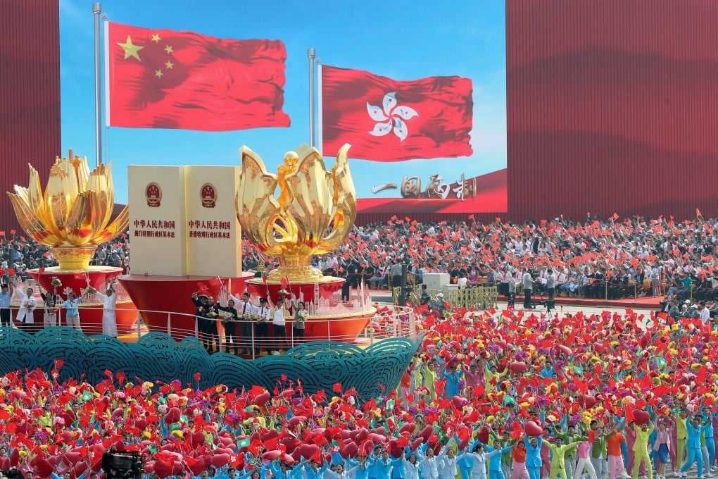 A float featuring the national and Hong Kong flags passes through Tiananmen Square during a parade marking China’s National Day. Photo: Reuters