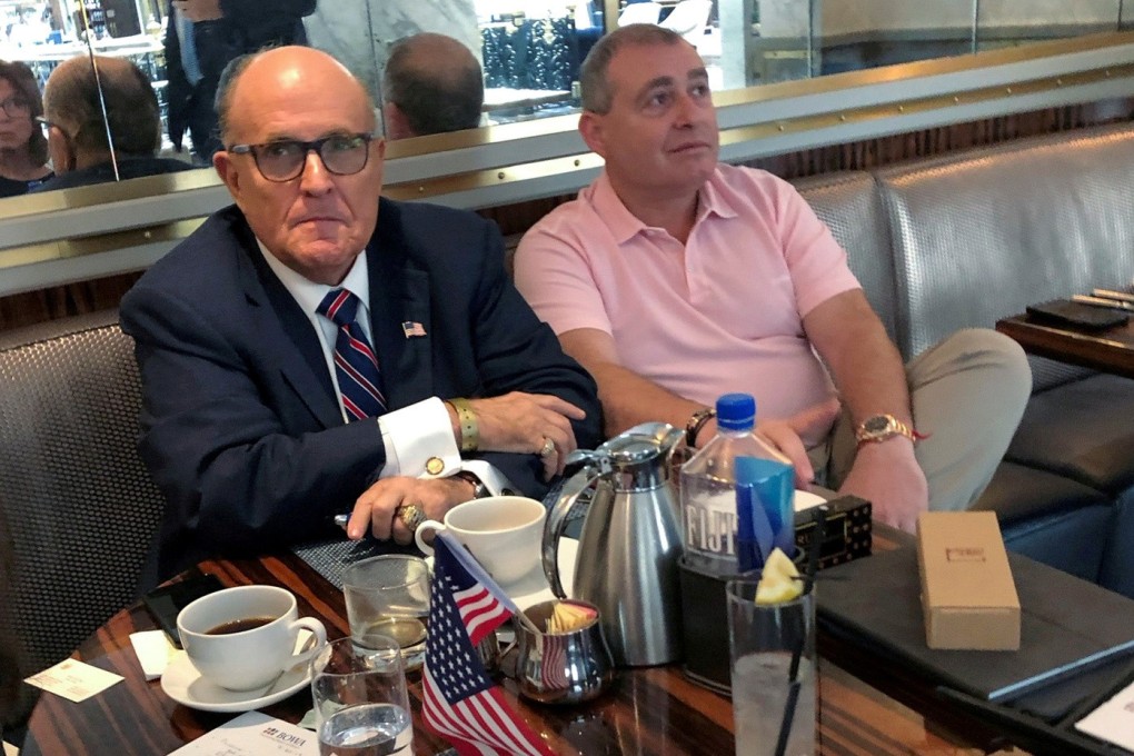 US President Donald Trump's personal lawyer Rudy Giuliani has coffee with Ukrainian-American businessman Lev Parnas at the Trump International Hotel in Washington in September. Photo: Reuters