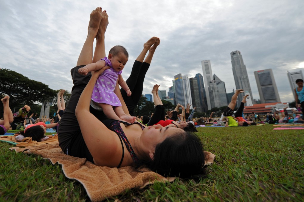 Parenthood: a balancing act many Singaporeans feel unprepared for. Photo: Xinhua