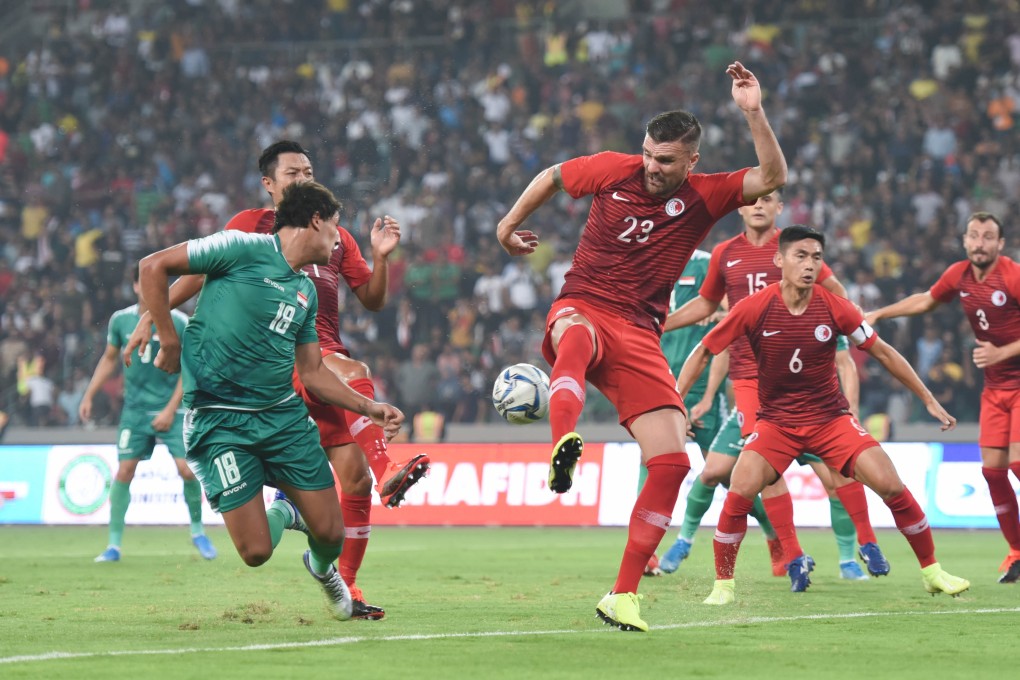 Defender Andrew Russell and captain Huang Yang in strong defence