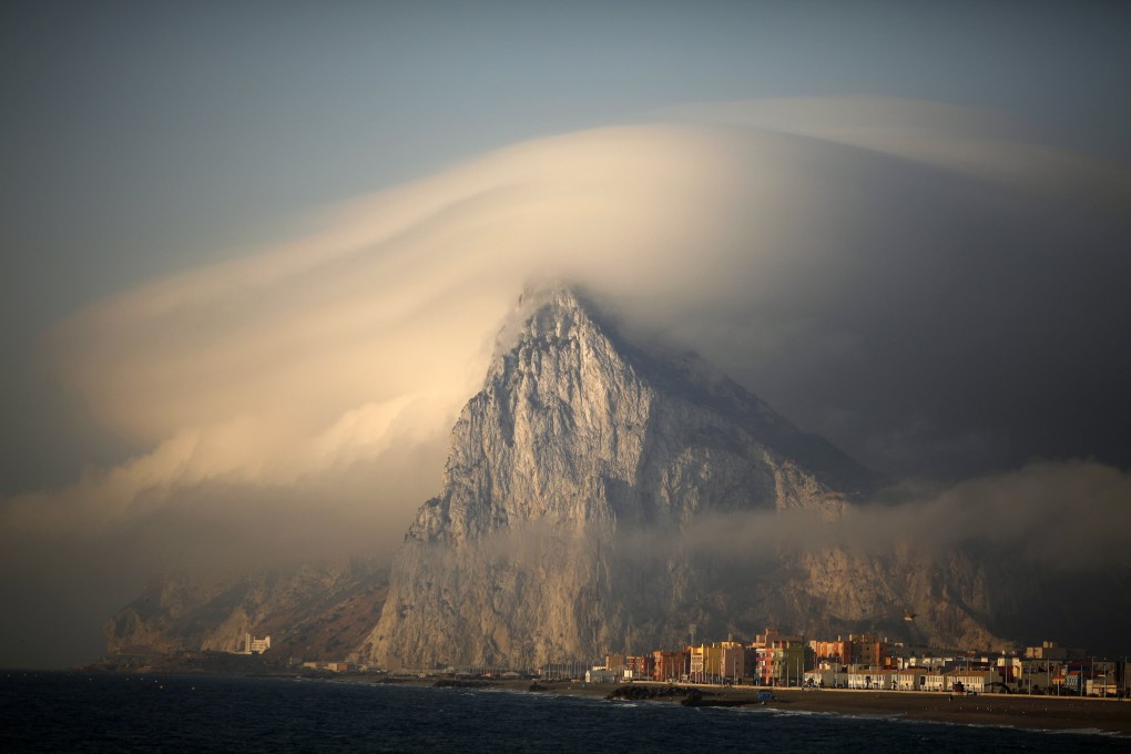 A cloud partially covers the tip of the Rock of the British territory of Gibraltar. Photo: Reuters