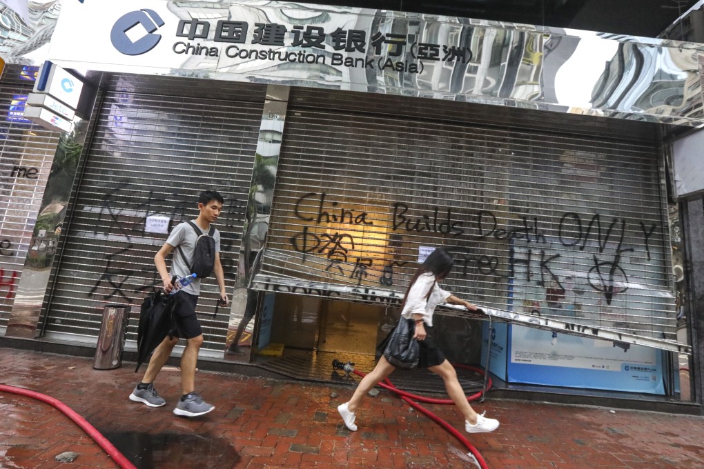A China Construction Bank branch vandalised by protesters following a rally in defiance of the anti-mask law issued by the government on October 5, 2019. Photo: Felix Wong