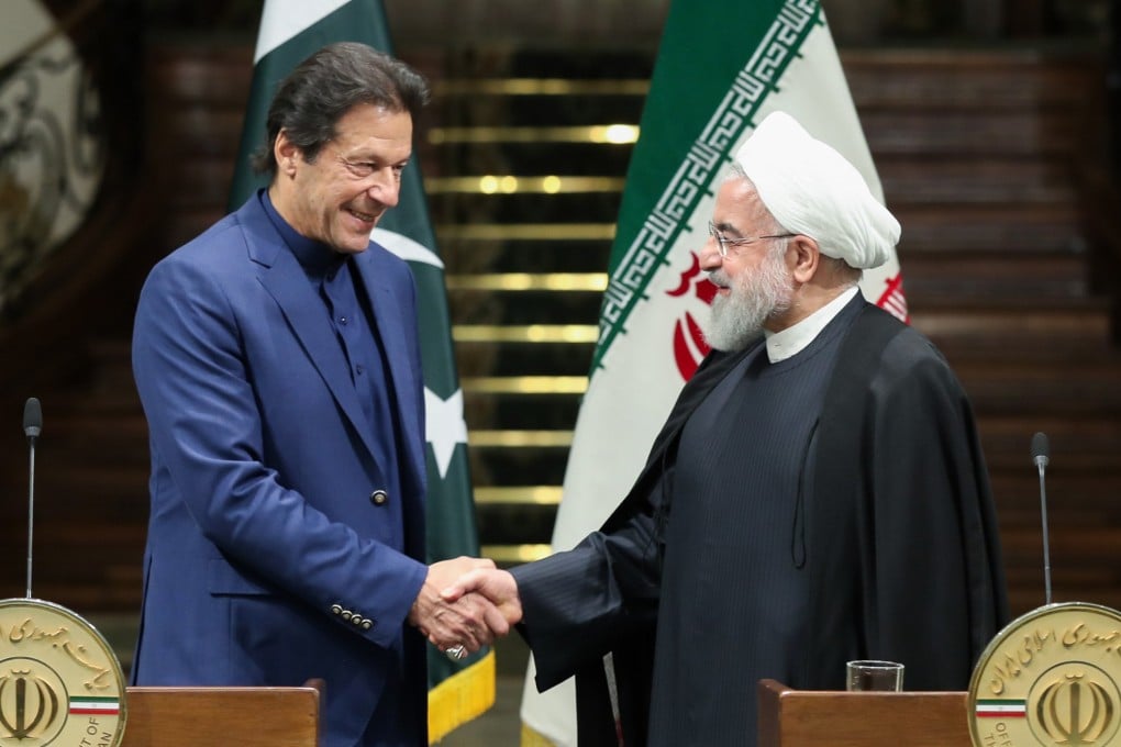 Pakistan’s Prime Minister Imran Khan with Iranian President Hassan Rowhani. Photo: AFP