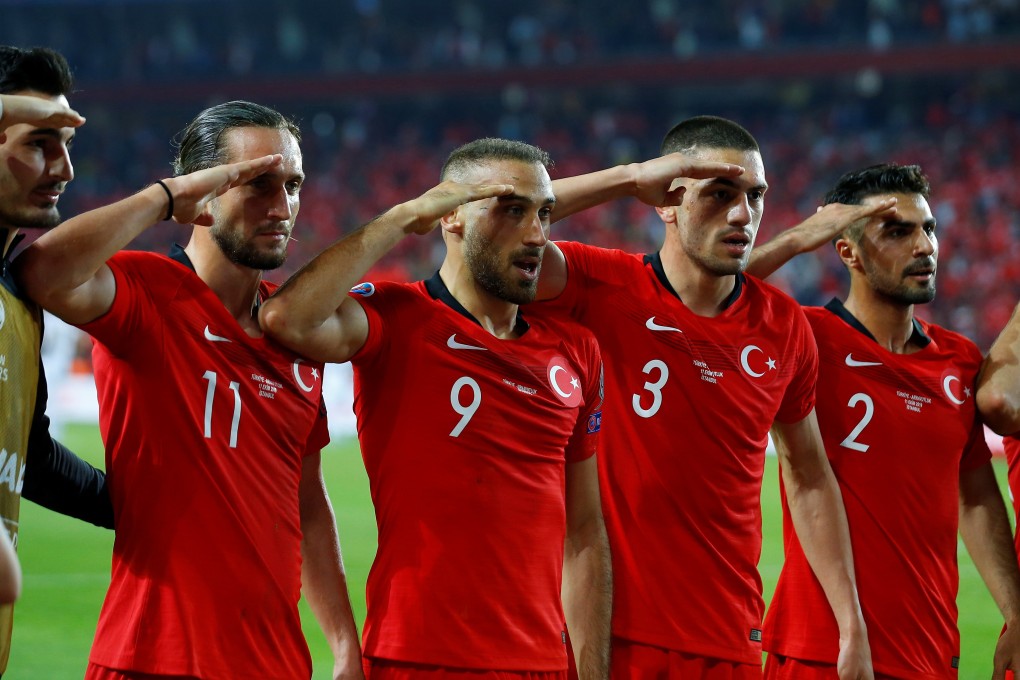 Turkey's Cenk Tosun celebrates scoring their first goal in the match against Albania. Photo: REUTERS
