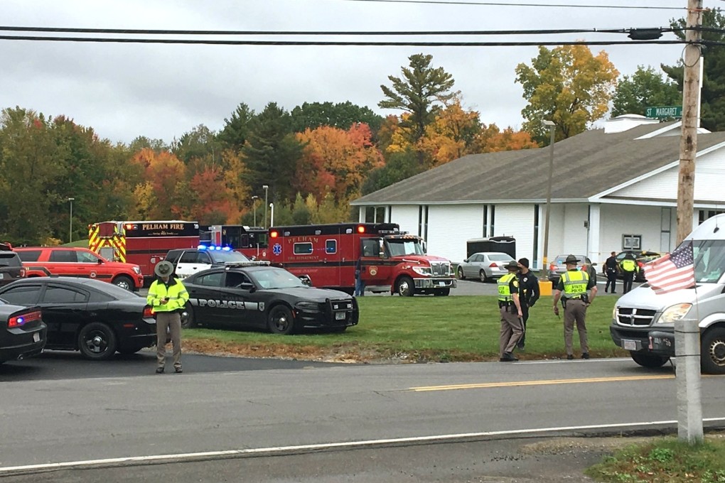 Police stand outside the New England Pentecostal Church after reports of a shooting. Photo: WMUR-TV via AP