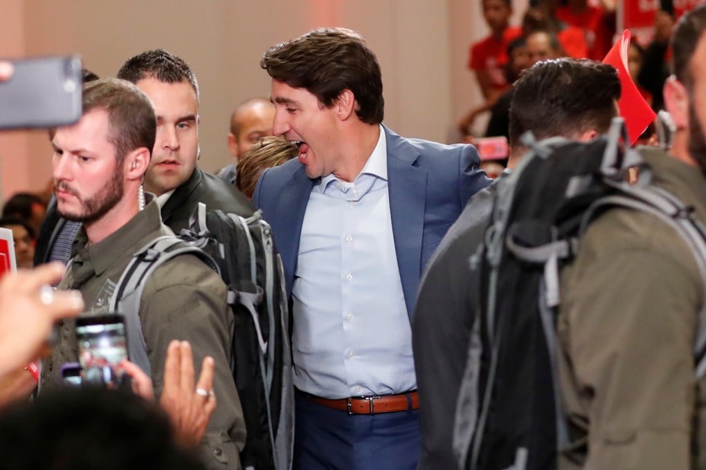 Prime Minister Justin Trudeau wore a suit jacket rather than his usual rolled-up sleeves and loosened tie, and was wearing a vest. Photo: Reuters