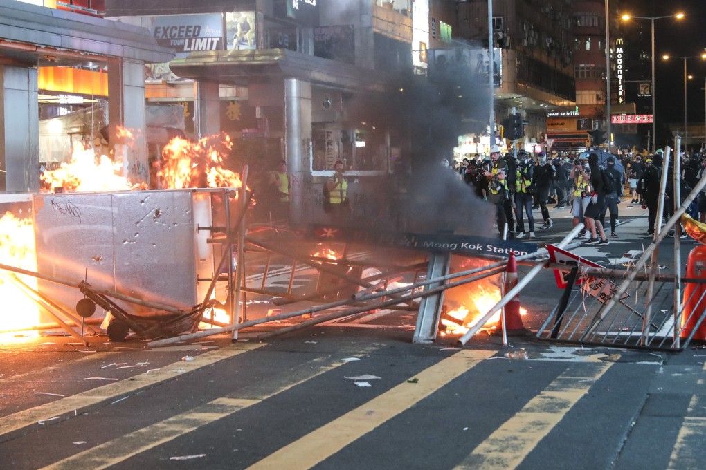 Anti-government protesters set fire to barricades in Mong Kok following a rally in defiance of the anti-mask law issued by the government on October 5, 2019. Photo: Edmond So